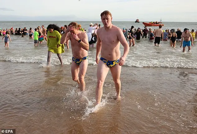 Festive Frolics: Brave Swimmers Mark New Year in Icy Waters of Whitley Bay