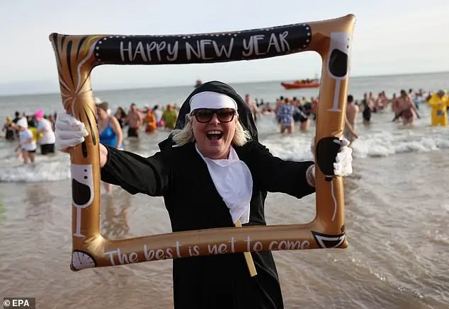 Festive Frolics: Brave Swimmers Mark New Year in Icy Waters of Whitley Bay