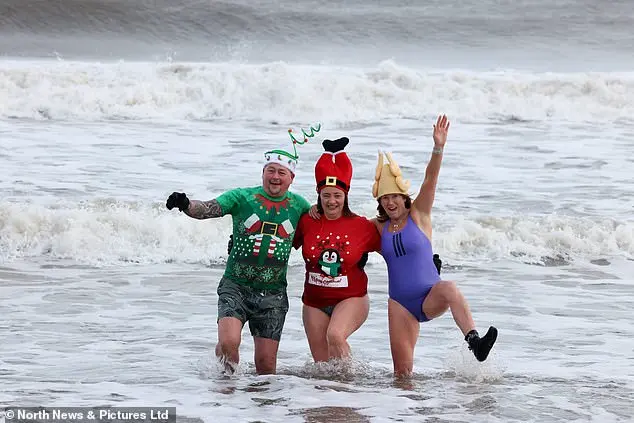 Festive Frolics: Brave Swimmers Mark New Year in Icy Waters of Whitley Bay