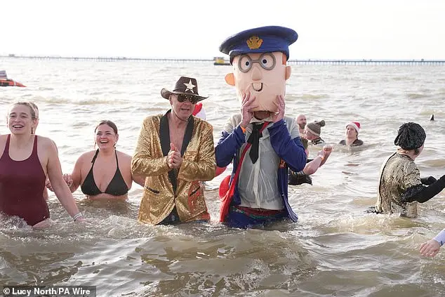 Festive Frolics: Brave Swimmers Mark New Year in Icy Waters of Whitley Bay