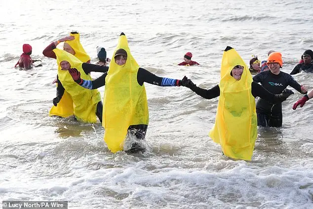Festive Frolics: Brave Swimmers Mark New Year in Icy Waters of Whitley Bay