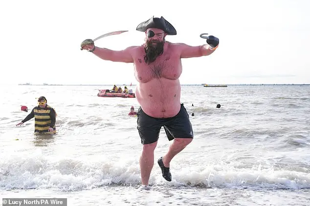 Festive Frolics: Brave Swimmers Mark New Year in Icy Waters of Whitley Bay