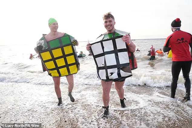 Festive Frolics: Brave Swimmers Mark New Year in Icy Waters of Whitley Bay