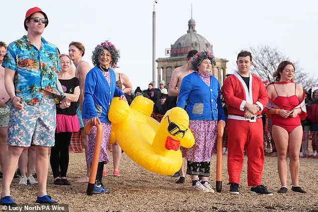 Festive Frolics: Brave Swimmers Mark New Year in Icy Waters of Whitley Bay