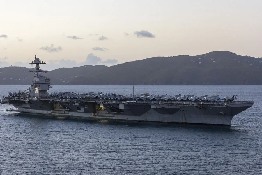 Iran Warns U.S. Carrier Presence in Red Sea Poses Existential Threat, Eyes Targeting Supporting Infrastructure Amid Escalation Fears