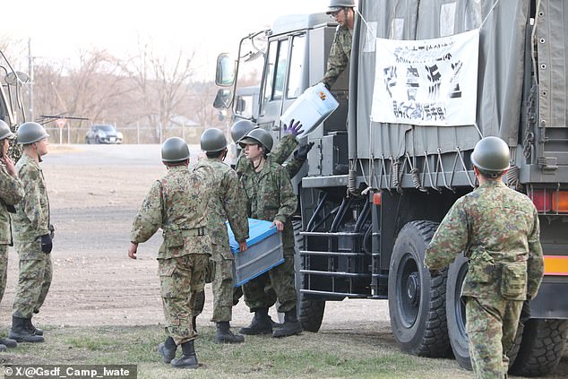 Japan evacuates coast after 7.5-magnitude quake triggers massive tsunami waves.