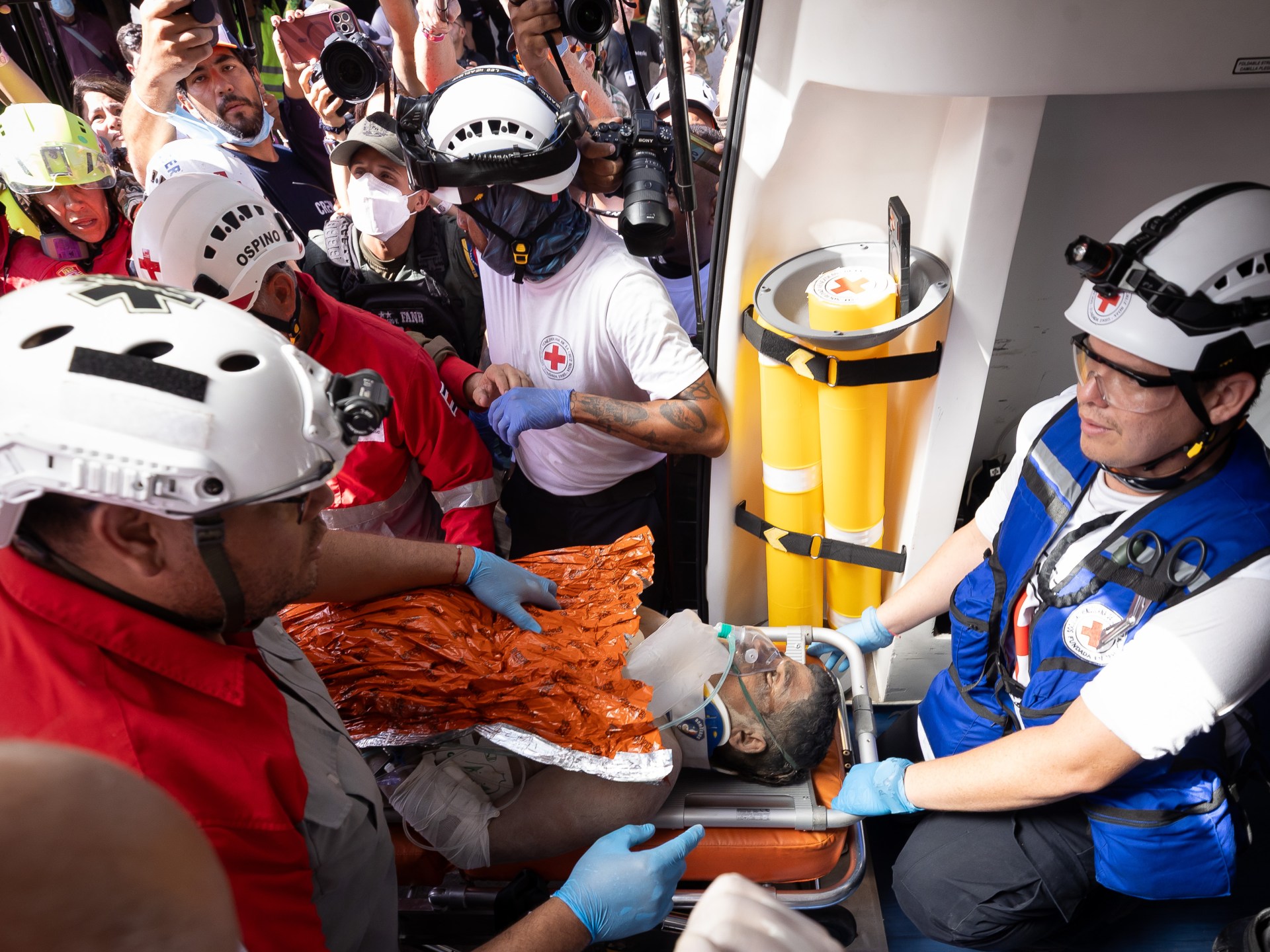 Miracle survivor Hernan Gil rescued after eight days in Venezuela quake rubble.