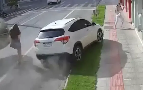 Near-Death Experience: Woman Escapes Pick-Up Truck's Path in Brazil