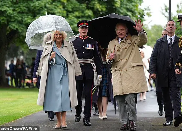 King Charles and Queen Camilla's Resilient Arrival in Kirkcaldy Amid Scottish Rain
